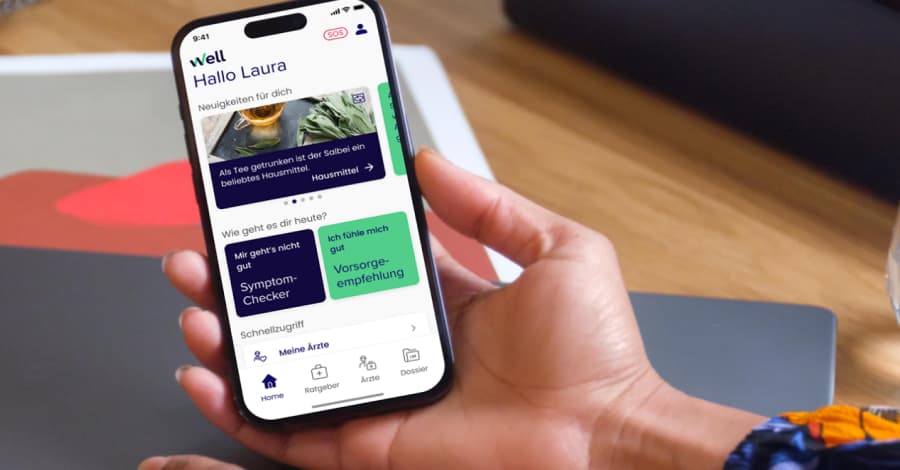 Hand mit Smartphone mit geöffneter Well-App in der Hand